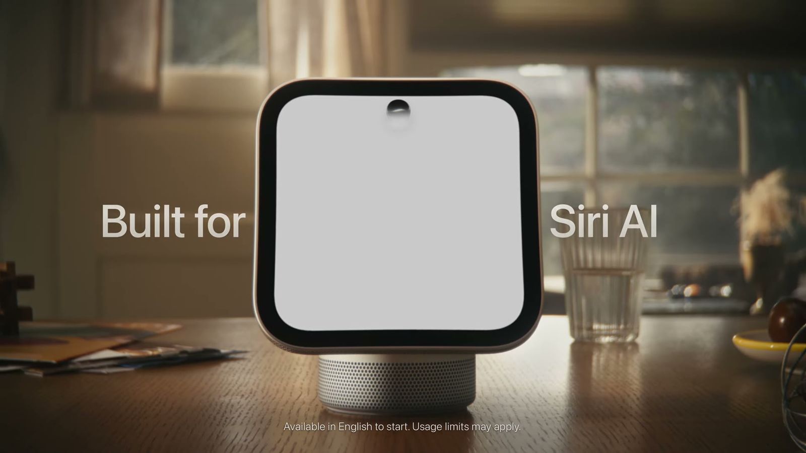 官方影片畫面：空白的 HomeView 螢幕，兩側字幕寫著 Built for Siri AI，底部小字註明目前僅提供英文